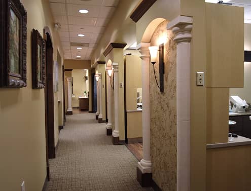Smiles Art Dentistry
| Interior hallway of a dental office with arched doorways and warm lighting.